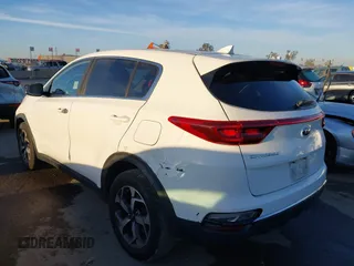 2020 Kia Sportage LX with VIN KNDPM3AC2L7733689, listed as a IAAI auction lot 41858043 with 93,979 mi miles and . Bid and sale history available at DreamBid. Image 3.