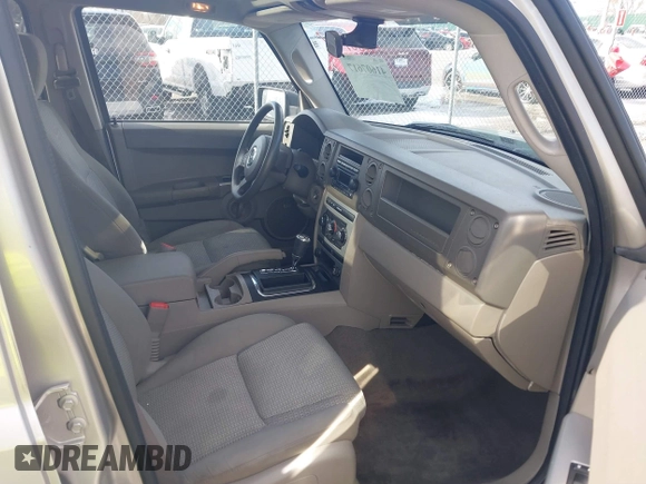 2007 Jeep Commander Sport z VIN 1J8HG48KX7C669647, wystawiony jako IAAI lot #41607617 z przebiegiem 333 861 mil mil oraz . Historia ofert i sprzedaży dostępna na DreamBid. Obrazek 5.