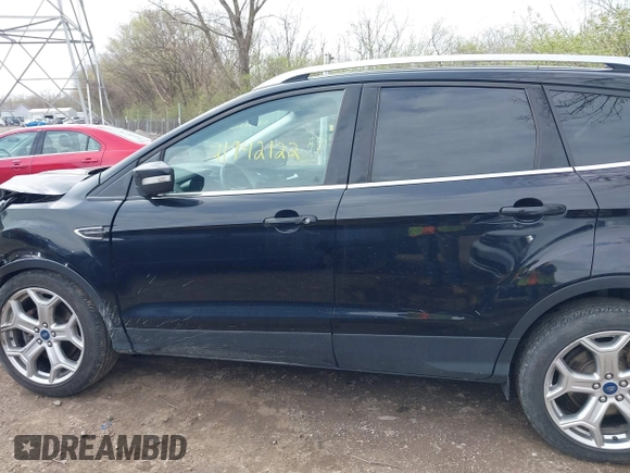 2019 Ford Escape Titanium with VIN 1FMCU9J91KUC42161, listed as a IAAI auction lot 41942122 with 100,677 mi miles and . Bid and sale history available at DreamBid. Image 14.