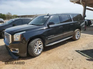2020 GMC Yukon XL SLT z VIN 1GKS1GKCXLR146352, wystawiony jako Copart lot #51476025 z przebiegiem 106 663 mil mil oraz Szkody całkowita. Historia ofert i sprzedaży dostępna na DreamBid. Obrazek 1.
