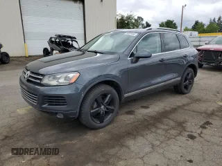 2013 Volkswagen Touareg Sport с VIN WVGEP9BP7DD007828, выставлен на аукционе Copart как лот 56951644 с пробегом 148 333 миль миль и Списание • Salvage title. История ставок и продаж доступна на DreamBid. Изображение 1.