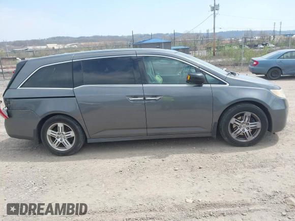 2012 Honda Odyssey Touring with VIN 5FNRL5H90CB045430, listed as a IAAI auction lot 42079770 with 113,901 mi miles and . Bid and sale history available at DreamBid. Image 14.