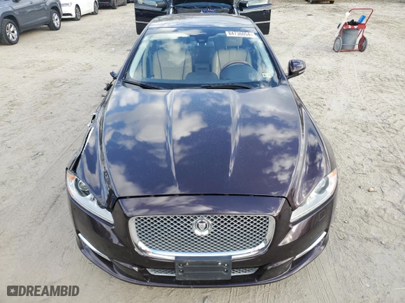 2013 Jaguar XJ with VIN SAJWA2G12DLV57581, listed as a Copart auction lot 84736054 with 91,779 mi miles and Salvage Title. Bid and sale history available at carsss.com. Image 5.
