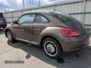2013 Volkswagen Beetle with VIN 3VWHX7AT8DM603424, listed as a Copart auction lot 51019185 with 136,196 mi miles and Salvage Title. Bid and sale history available at DreamBid. Image 2.