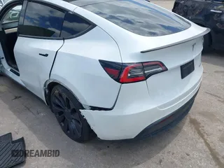 2021 Tesla Model Y Performance with VIN 5YJYGDEF9MF081798, listed as a IAAI auction lot 42033358 with 64,679 mi miles and . Bid and sale history available at DreamBid. Image 6.
