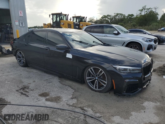 2022 BMW 7 Series 750i xDrive with VIN WBA7U2C01NCK83702, listed as a Copart auction lot 74327704 with Not provided miles and Salvage title. Bid and sale history available at DreamBid. Image 4.