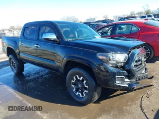 2018 Toyota Tacoma SR with VIN 5TFCZ5ANXJX124991, listed as a IAAI auction lot 41136867 with 57,980 mi miles and . Bid and sale history available at carsss.com. Image 1.