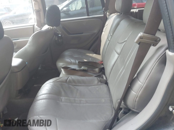 2004 Jeep Grand Cherokee Laredo with VIN 1J4GW48NX4C405558, listed as a IAAI auction lot 42440639 with 197,457 mi miles and . Bid and sale history available at DreamBid. Image 8.