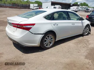 2014 Toyota Avalon Limited with VIN 4T1BK1EB4EU105266, listed as a IAAI auction lot 42006448 with 111,822 mi miles. Bid and sale history available at carsss.com. Image 4.
