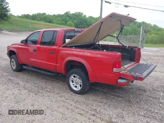 2002 Dodge Dakota Sport with VIN 1B7HG38N62S670613, listed as a IAAI auction lot 42133366 with 156,977 mi miles and . Bid and sale history available at carsss.com. Image 3.