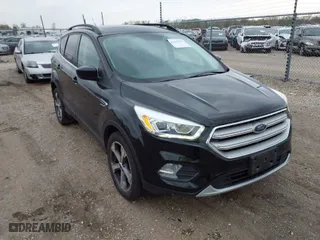 2017 Ford Escape SE with VIN 1FMCU9G9XHUB26957, listed as a IAAI auction lot 42036303 with 105,095 mi miles. Bid and sale history available at carsss.com. Image 1.