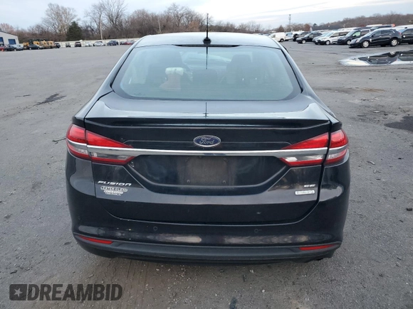 2017 Ford Fusion SE z VIN 3FA6P0HD1HR312200, wystawiony jako Copart lot #82823184 z przebiegiem Nie podano mil oraz Szkoda całkowita • Salvage title. Historia ofert i sprzedaży dostępna na DreamBid. Obrazek 6.