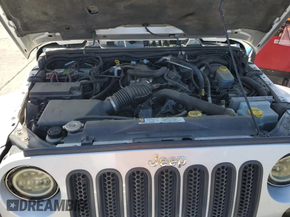 2009 Jeep Wrangler Sahara with VIN 1J4FA54149L708183, listed as a Copart auction lot 65989125 with 133,436 mi miles and Salvage title. Bid and sale history available at DreamBid. Image 11.