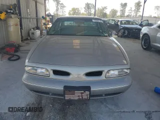 1998 Oldsmobile 88 LS z VIN 1G3HN52K4W4803377, wystawiony jako Copart lot #75638114 z przebiegiem 75 754 mil mil oraz Tytuł czysty. Historia ofert i sprzedaży dostępna na DreamBid. Obrazek 5.