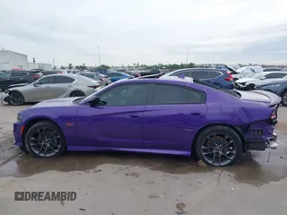 2023 Dodge Charger Scat Pack Widebody with VIN 2C3CDXGJ5PH699595, listed as a IAAI auction lot 41303894 with 1,828 mi miles and . Bid and sale history available at DreamBid. Image 15.