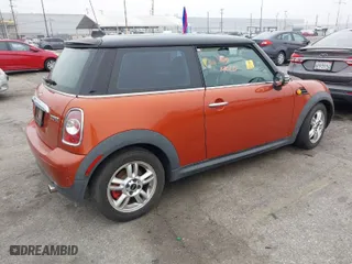 2011 MINI Cooper Hardtop with VIN WMWSU3C55BT097555, listed as a IAAI auction lot 42043733 with 185,071 mi miles. Bid and sale history available at carsss.com. Image 4.