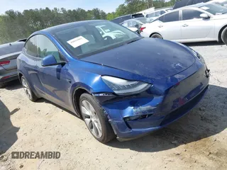 2021 Tesla Model Y Standard Range z VIN 5YJYGDED8MF116359, wystawiony jako IAAI lot #42031062 z przebiegiem 80 356 mil mil oraz . Historia ofert i sprzedaży dostępna na DreamBid. Obrazek 1.