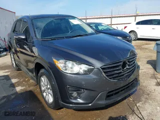 2016 Mazda CX-5 Touring with VIN JM3KE4CY3G0672977, listed as a IAAI auction lot 41889137 with 130,593 mi miles. Bid and sale history available at carsss.com. Image 1.