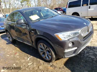 2016 BMW X4 xDrive35i with VIN 5UXXW5C5XG0N91545, listed as a Copart auction lot 36334233 with 69,740 mi miles. Bid and sale history available at carsss.com. Image 4.