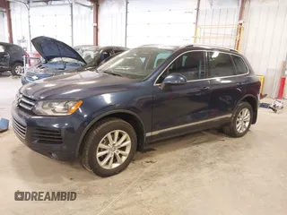2014 Volkswagen Touareg Sport with VIN WVGEF9BP9ED008967, listed as a IAAI auction lot 41984409 with 193,859 mi miles and . Bid and sale history available at DreamBid. Image 17.