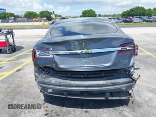2016 Tesla Model S 70 with VIN 5YJSA1E16GF156312, listed as a IAAI auction lot 42469451 with 90,317 mi miles and . Bid and sale history available at DreamBid. Image 17.