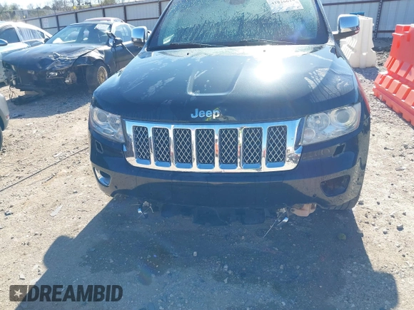 2013 Jeep Grand Cherokee Overland with VIN 1C4RJFCT1DC654653, listed as a IAAI auction lot 41826619 with 124,283 mi miles. Bid and sale history available at carsss.com. Image 6.