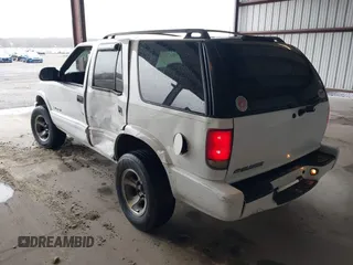 2004 Chevrolet Blazer LS z VIN 1GNDT13X64K129093, wystawiony jako IAAI lot #41860109 z przebiegiem 175 588 mil mil oraz . Historia ofert i sprzedaży dostępna na DreamBid. Obrazek 3.