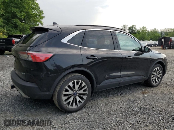2020 Ford Escape Titanium с VIN 1FMCU9J97LUA20595, выставлен на аукционе Copart как лот 59476745 с пробегом 74 518 миль миль и Списание • Salvage title. История ставок и продаж доступна на DreamBid. Изображение 3.