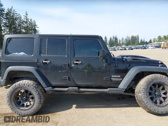 2015 Jeep Wrangler Unlimited Willys Wheeler with VIN 1C4BJWDG9FL750049, listed as a IAAI auction lot 42136188 with 115,328 mi miles and . Bid and sale history available at DreamBid. Image 14.