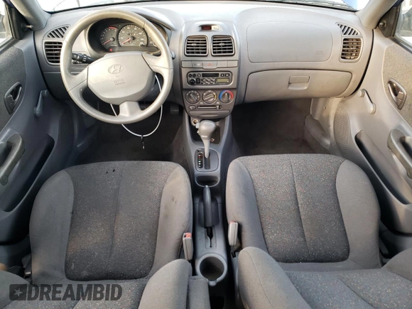 2000 Hyundai Accent z VIN KMHCG45GXYU125691, wystawiony jako Copart lot #87253294 z przebiegiem 91 062 mil mil oraz Szkoda całkowita • Salvage title. Historia ofert i sprzedaży dostępna na DreamBid. Obrazek 8.