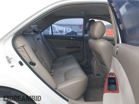 2003 Toyota Camry LE z VIN JTDBF30K530148403, wystawiony jako IAAI lot #41688346 z przebiegiem 299 143 mil mil oraz . Historia ofert i sprzedaży dostępna na DreamBid. Obrazek 8.