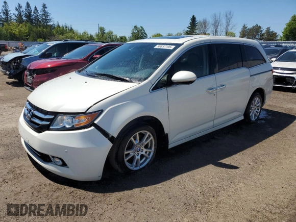 2015 Honda Odyssey Touring Elite with VIN 5FNRL5H92FB504977, listed as a Copart auction lot 56657195 with 189,438 mi miles and Salvage title. Bid and sale history available at DreamBid. Image 1.