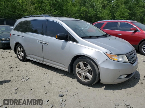 2012 Honda Odyssey Touring with VIN 5FNRL5H93CB121366, listed as a Copart auction lot 55383885 with 197,885 mi miles and Salvage title. Bid and sale history available at DreamBid. Image 4.