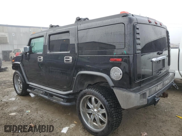 2003 Hummer H2 with VIN 5GRGN23U83H143843, listed as a Copart auction lot 43792915 with 115,569 mi miles and Salvage Title. Bid and sale history available at carsss.com. Image 2.