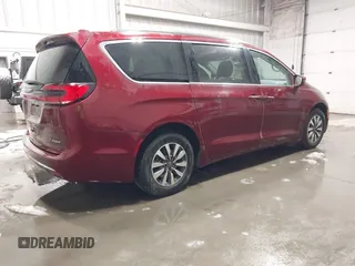 2021 Chrysler Pacifica Hybrid Touring L with VIN 2C4RC1L71MR581260, listed as a IAAI auction lot 42014401 with 68,719 mi miles and . Bid and sale history available at DreamBid. Image 4.