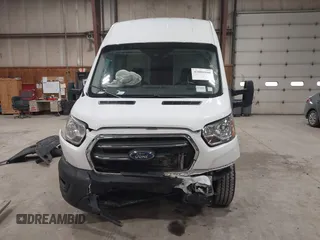 2020 Ford Transit Cargo with VIN 1FTBR3X85LKA65544, listed as a IAAI auction lot 42006800 with 55,497 mi miles and . Bid and sale history available at DreamBid. Image 13.