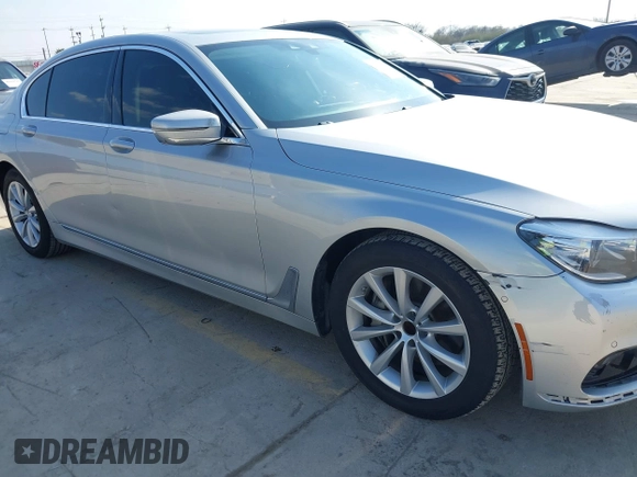 2016 BMW 7 Series 740i with VIN WBA7E2C5XGG739099, listed as a IAAI auction lot 41526038 with 123,900 mi miles. Bid and sale history available at carsss.com. Image 6.