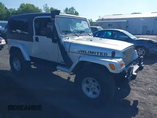 2005 Jeep Wrangler Unlimited with VIN 1J4FA44S55P352803, listed as a IAAI auction lot 42688284 with 128,586 mi miles and . Bid and sale history available at DreamBid. Image 1.