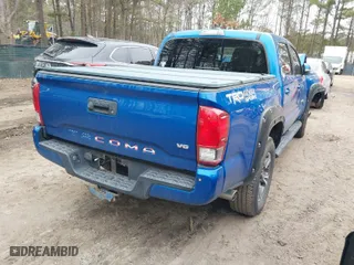 2017 Toyota Tacoma SR5 with VIN 3TMCZ5AN6HM114619, listed as a IAAI auction lot 41590012 with 165,936 mi miles. Bid and sale history available at carsss.com. Image 4.