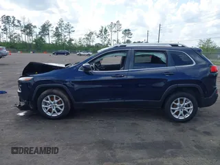 2015 Jeep Cherokee Latitude with VIN 1C4PJLCB5FW694359, listed as a IAAI auction lot 41934213 with 117,723 mi miles and . Bid and sale history available at DreamBid. Image 14.