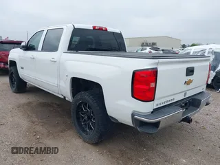 2018 Chevrolet Silverado 1500 LT with VIN 3GCPCREC7JG402401, listed as a IAAI auction lot 41880462 with 128,995 mi miles and . Bid and sale history available at DreamBid. Image 3.