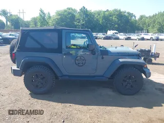 2015 Jeep Wrangler Freedom Edition with VIN 1C4AJWAG1FL714002, listed as a IAAI auction lot 42579024 with 98,732 mi miles and . Bid and sale history available at DreamBid. Image 13.