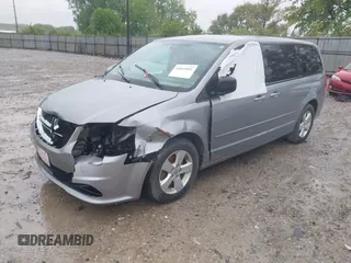 2013 Dodge Grand Caravan SE with VIN 2C4RDGBG2DR773577, listed as a IAAI auction lot 41823951 with 226,498 mi miles and . Bid and sale history available at DreamBid. Image 2.