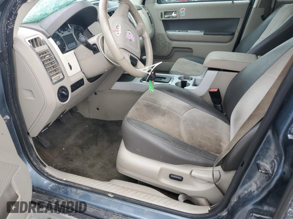 2010 Mercury Mariner Premier with VIN 4M2CN8HG3AKJ16128, listed as a Copart auction lot 58649895 with 157,798 mi miles and Salvage title. Bid and sale history available at DreamBid. Image 7.