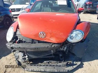 2019 Volkswagen Beetle S with VIN 3VWFD7AT7KM719940, listed as a IAAI auction lot 41190839 with 77,627 mi miles. Bid and sale history available at carsss.com. Image 6.