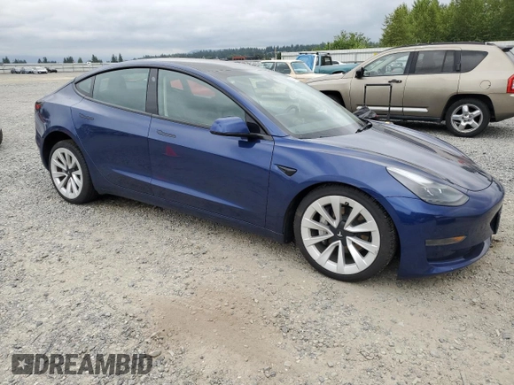 2023 Tesla Model 3 with VIN 5YJ3E1EA7PF450973, listed as a Copart auction lot 61082175 with 47,029 mi miles and Salvage title. Bid and sale history available at DreamBid. Image 4.