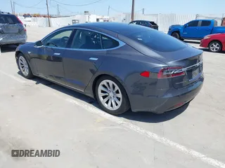2016 Tesla Model S 90D with VIN 5YJSA1E22GF138236, listed as a IAAI auction lot 42532245 with 72,839 mi miles and . Bid and sale history available at DreamBid. Image 3.