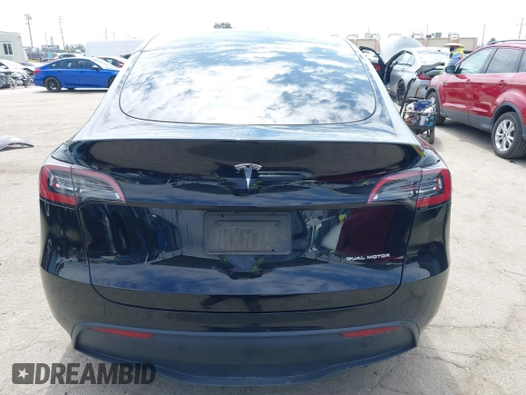 2023 Tesla Model Y Long Range z VIN 7SAYGDEE2PF863200, wystawiony jako IAAI lot #41805168 z przebiegiem 25 480 mil mil oraz . Historia ofert i sprzedaży dostępna na DreamBid. Obrazek 17.