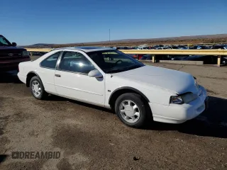 1994 Ford Thunderbird LX with VIN 1FALP62WXRH217279, listed as a Copart auction lot 80512504 with 176,798 mi miles and Salvage Title. Bid and sale history available at DreamBid. Image 4.