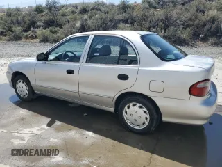 1998 Hyundai Accent z VIN KMHVF24N8WU500040, wystawiony jako Copart lot #52039755 z przebiegiem 103 631 mil mil oraz Szkody całkowita. Historia ofert i sprzedaży dostępna na DreamBid. Obrazek 2.